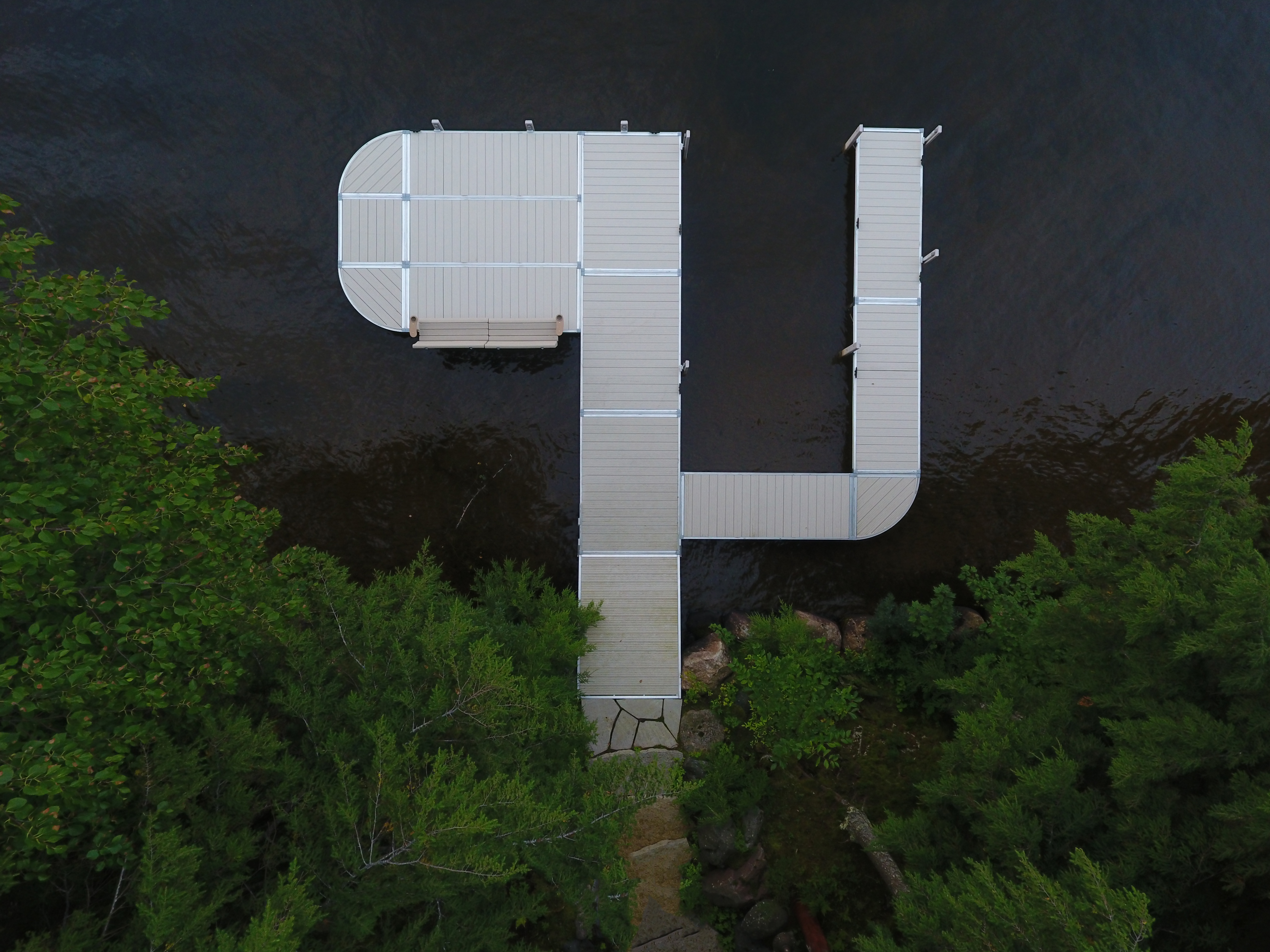 Overhead view of RS4 tan aluminum 6ft dock sections with integrated double bench
